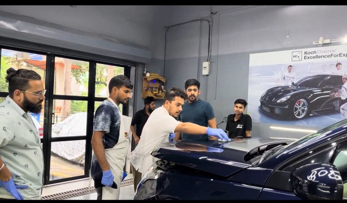 DOT41 team applying paint protection film in the studio